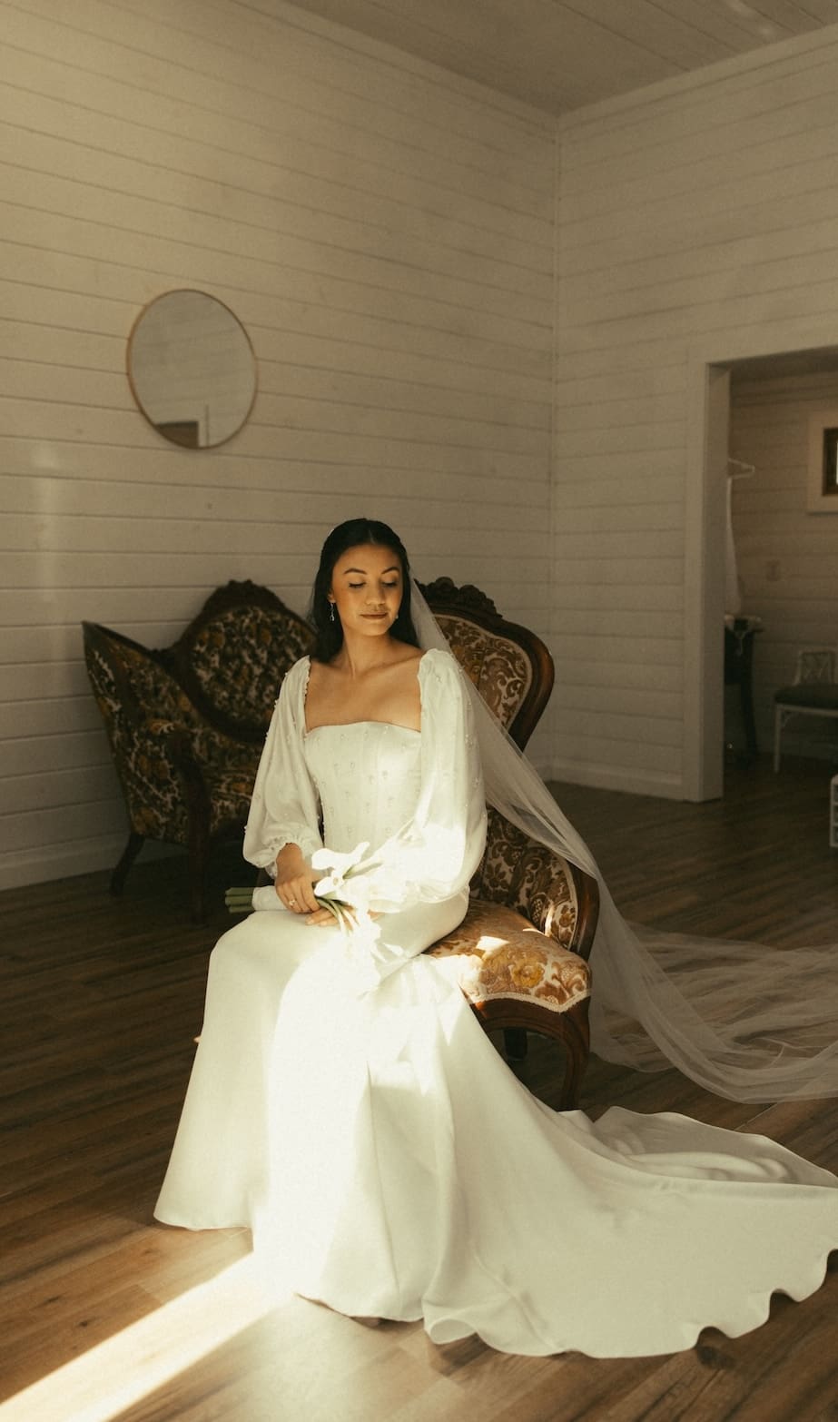 An editorial bridal portrait in a sunlit historic room, designed by Olive & Eden for a Fredericksburg wedding.